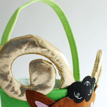 Load image into Gallery viewer, Eid al Adha Basket designed like a ram. The ram has plush gold horns. Available to shop at Hello Holy Days!
